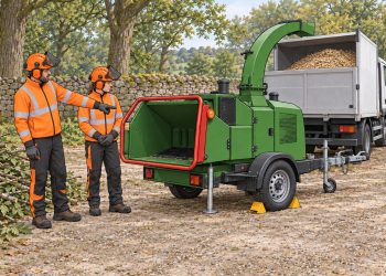 Cartoon illustration of a woodchipper with two operators discussing the controls.